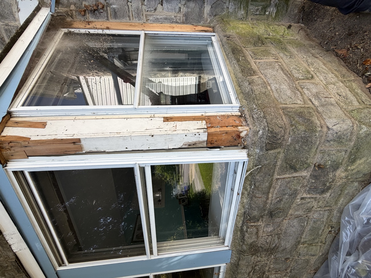 New energy-efficient Pella casement set fitted into the bay opening.